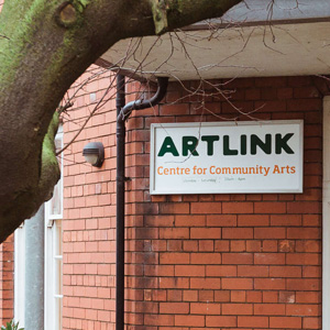 A building with a sign that reads “Artlink Hull”